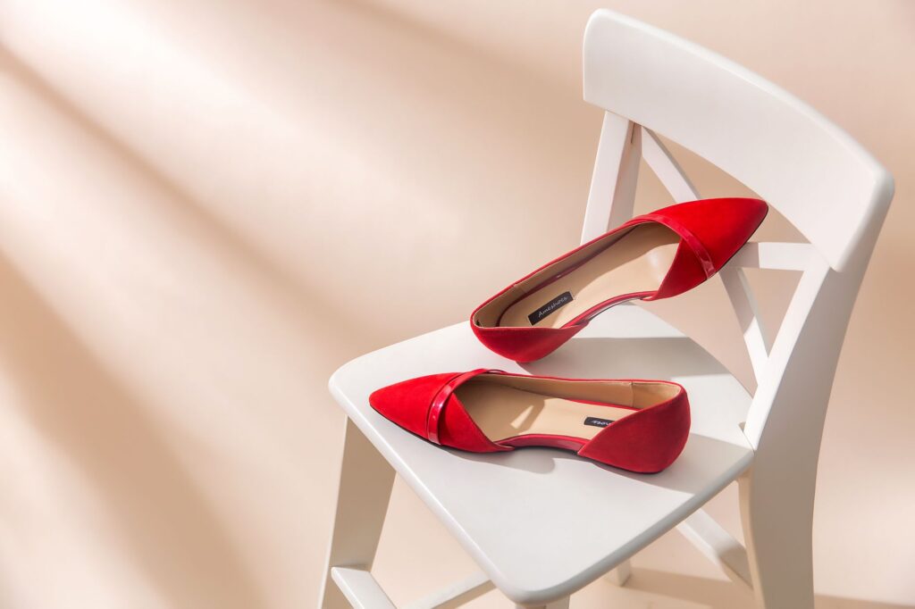 red shoes on white chair